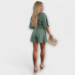 Marita | Elegant playsuit med knytskärp