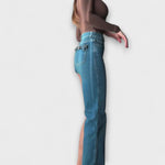 Selina | Asymmetriska denimshorts med axelrem
