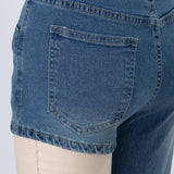 Selina | Asymmetriska denimshorts med axelrem